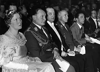 A group of seated people in formal dress.