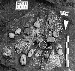 Burial gifts of a sub-floor burial from a round building of Körtik Tepe