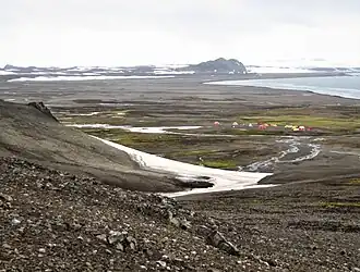 South Beaches on Byers Peninsula, Livingston Island, with Camp Byers in the foreground, and left to right Tsamblak Hill, Negro Hill and Dometa Point in the background