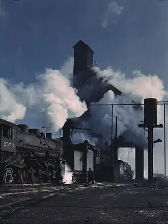Locomotive 2576 over the ash pit at the roundhouse and coaling station, now demolished, at the Chicago and Northwestern Railroad yards, Chicago, Illinois, December 1942