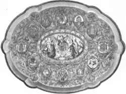 Oval frame, composed of a small illustration in the centre surrounded by a dozen medallions that occupy most of the frame. The central illustration represents a dozen characters, some of whom are dancing, as well as two angels.