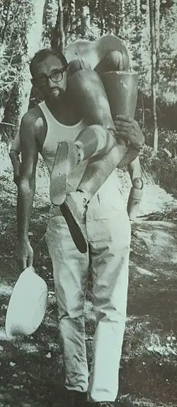 Carmen D'Avino carrying a mannequin during the making of A Finnish Fable (1965).