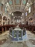 Baptismal font and nave in 2025