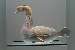 An earthenware goose pourer with lacquerware paint designs, Western Han dynasty, late 3rd century BC to early 1st century AD