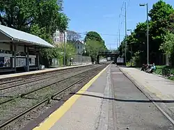 A train station with low-level side platforms