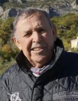 outdoor portrait of a greying caucasian male in his fifties wearing a padded jacket