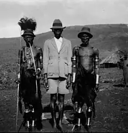 A Christian Gusii man accompanied with other Gusii tribesmen c. 1916–1938