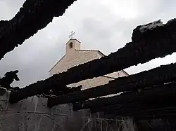 Photo showing the Church of the Multiplication after an arson attack on the adjacent library building.