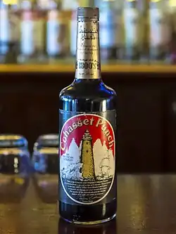 A bottle of Cohasset Punch from the mid-1980s sitting atop a bar.