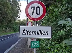 The now defunct white signage used to indicate entry to the Lieu-Dit