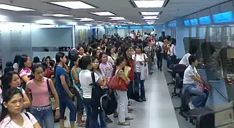 Government office, with long lines of young people