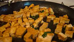 Tofu being fried