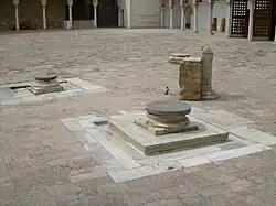 Sundial and wells in the courtyard
