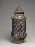 Albarello jar with lid. Manufactured in the second half of the 13th to early 14th century. Located at the Metropolitan Museum of Art in the Islamic Art collection.