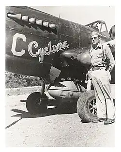 Cyclone Davis standing next to his P-40