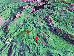 Oblique false-colour Landsat image of Darwin Crater (arrowed) draped over digital elevation model; screen capture from NASA World Wind