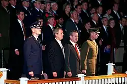 Secretary of Defense Donald Rumsfeld, President George W. Bush, Chairman of The Joint Chiefs of Staff General Richard B. Myers, and Vice Chairman of The Joint Chiefs of Staff General Peter Pace watch troops pass in review at Fort Myer, Virginia, on October 15, 2001.