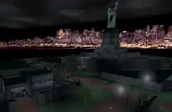 Statue of Liberty, depicted at nighttime, surrounded by a darkened island with grey structures, with skyline in the distance