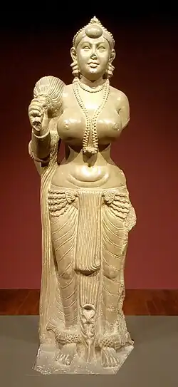 Didarganj Yakshi with fly-whisk (chauri) is held in the right hand whereas the left hand is broken, in the Bihar Museum