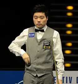 Ding Junhui holding his cue
