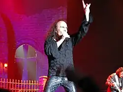 Vocalist Ronnie James Dio making the sign at a concert in 2007. The gesture is quite common within heavy metal culture.