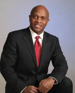 A photo of Spectar posing stylishly in front of a grey background