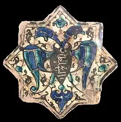 Double-headed eagle, with "al-Sultan" inscription on the chest. Kubadabad Palace, Türkiye, 1220s.[41]