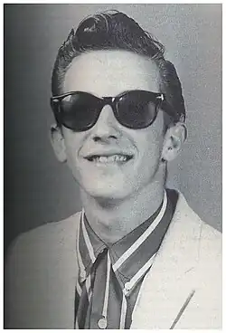 Photographic portrait of Sahm in his high school years wearing sunglasses