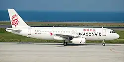 An Airbus A320-200 painted in Dragonair's livery taxiing on the taxiway