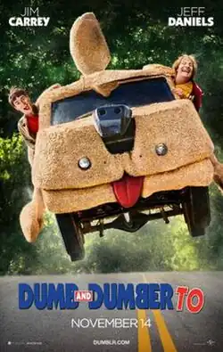 Jim Carrey's Lloyd Christmas and Jeff Daniels' Harry Dunne drive and jump the Mutt Cuts van over a hill.