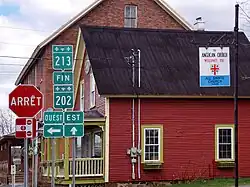 Junction with route 213 in Dunham.