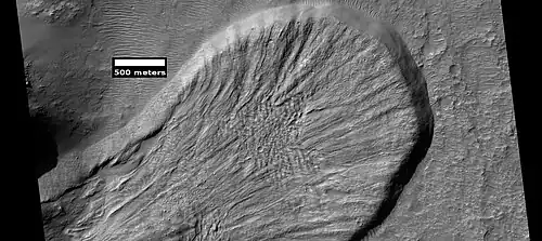 Landslide in a crater, as seen by HiRISE under HiWish program. Image from Iapygia quadrangle.