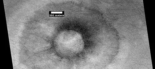 Pedestal crater with boulders along rim. Such craters are called "halo craters".[48] Picture taken with HiRISE under HiWish program.