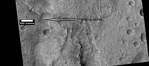 Hanging valley, as seen by HiRISE under HiWish program. This may have been a waterfall at one time.