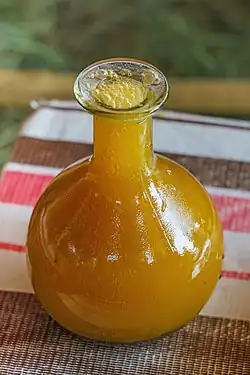 Image 2A berele glass containing tej, a honey wine brewed and consumed in Ethiopia. (from List of national drinks)