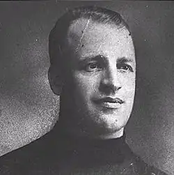 Portrait of Eddie Gerard, a white man with short hair looking slightly to his left.