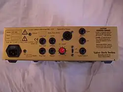 The rear panel of an amplifier unit is shown. Various jacks for plugging inputs and outputs are provided.