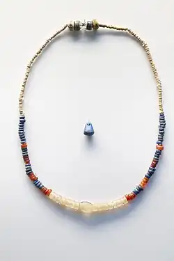 Egyptian necklace and pendant, using lapis lazuli imported from Afghanistan, possibly by Mesopotamian traders, Naqada II circa 3500 BCE, British Museum EA57765 EA57586.[35][36][37]