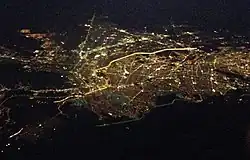 Aerial view of El Paso, Texas and Ciudad Juárez, Chihuahua; the brightly lighted border can clearly be seen as it divides the two cities at night.