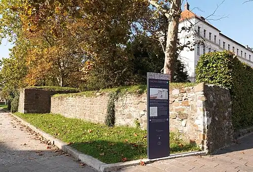 South Emona's wall with information panel. This location is one of the spots on a 2&nbsp;km (1&nbsp;mi) footpath, connecting the locations of ten ancient sites in present-day Ljubljana. Suggested starting point: City Museum of Ljubljana.