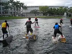 Students "walking" across a lake on various homemade setups