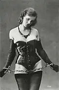 A woman in a corset and chains