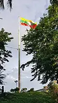 Flag of Myanmar flown at Bayint Naung Statue Garden Park in Kawthaung.
