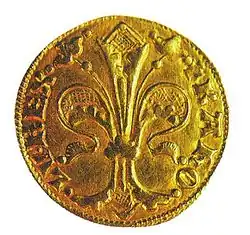 A golden coin depicting a lily