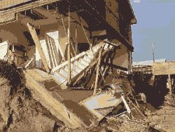A picture of a damaged beach house