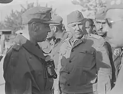Generalleutnant Otto Fretter-Pico (left) surrendering to General Olímpio Falconière da Cunha (center).
