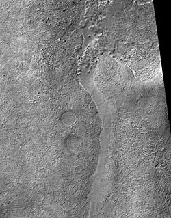 Frento Vallis in Noachis quadrangle, as seen by HiRISE. Click on image to see better view of Dust Devil Tracks. In the Arcadia quadrangle on Mars, its exact location is centered at 37 degrees north latitude and 93.1 degrees west longitude. It is 357&nbsp;km long and was named after a classical river.[11]