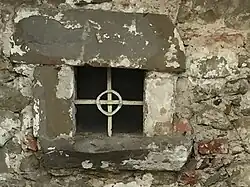 barred tiny window (before 1500)