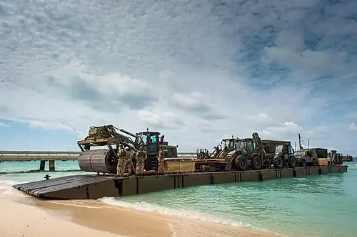 Mexeflote unloading on the beach at Grand Turk with heavy plant for use in the rebuild after the hurricane