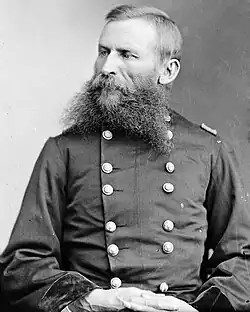 Old black and white picture of an American Civil War general (from the waist up) with a big grey beard and wearing his uniform
